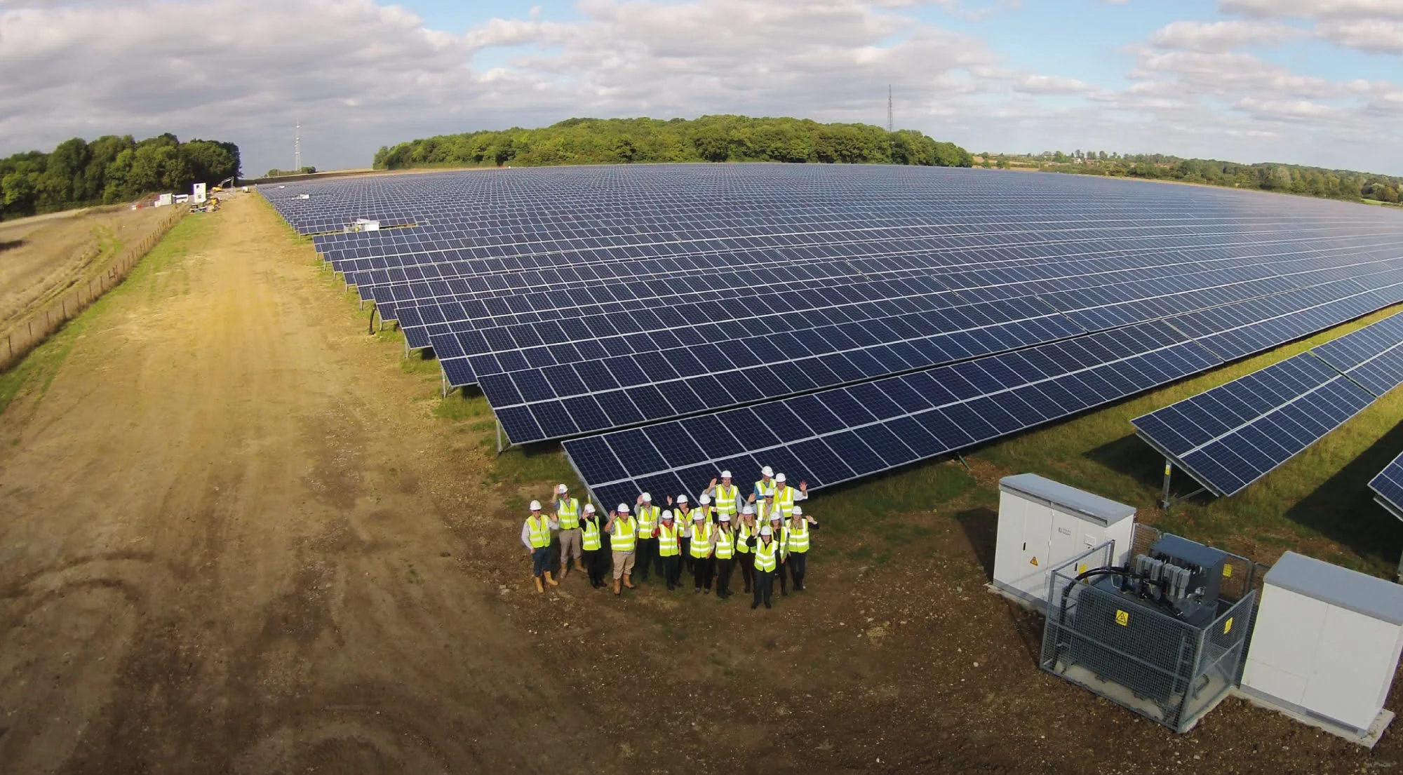PROINSO's constructors and solar panels on a field